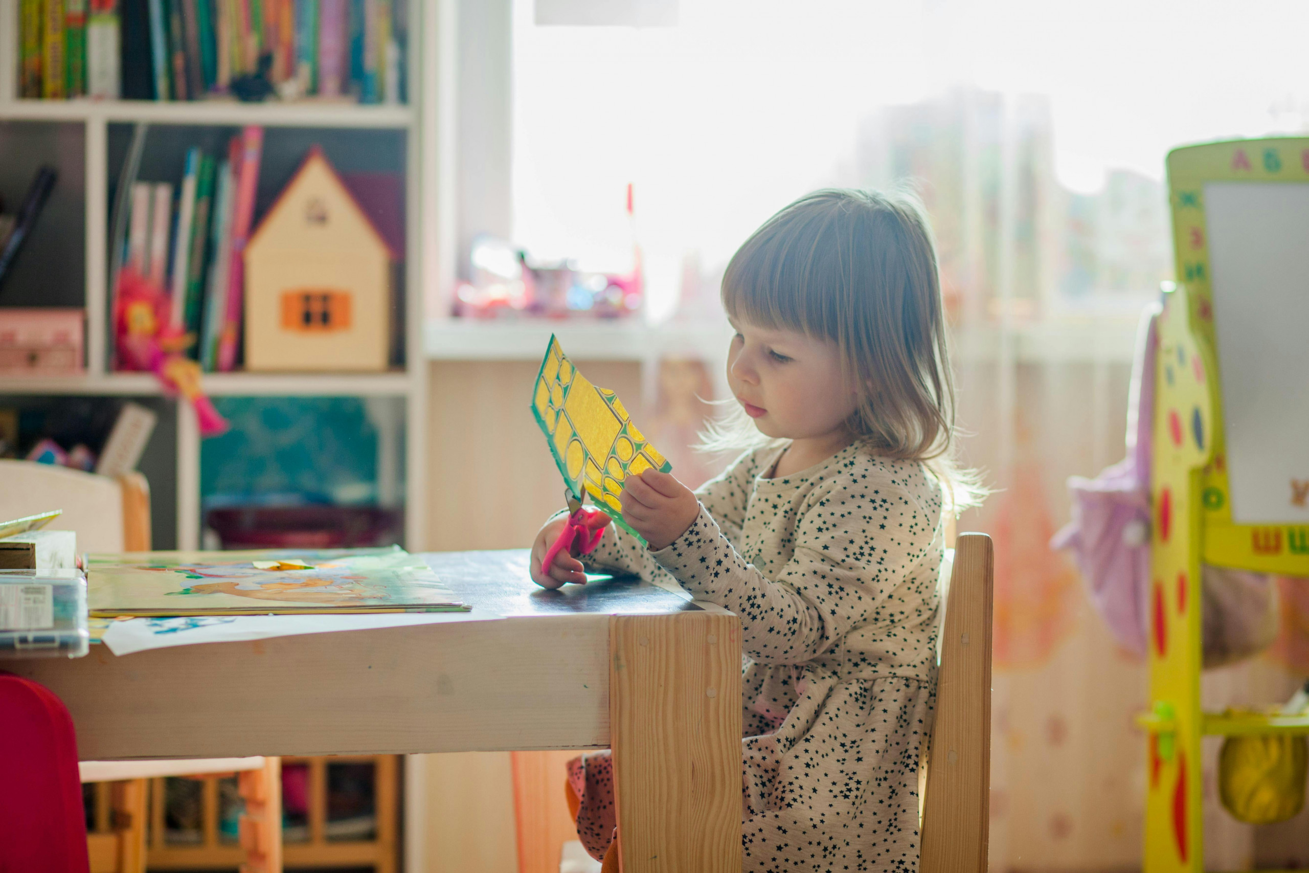 A young child playing happily at Bula Babies Learning Center